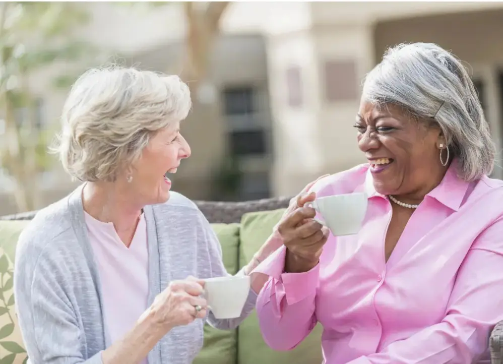 Two ladies enjoying a cup of tea together